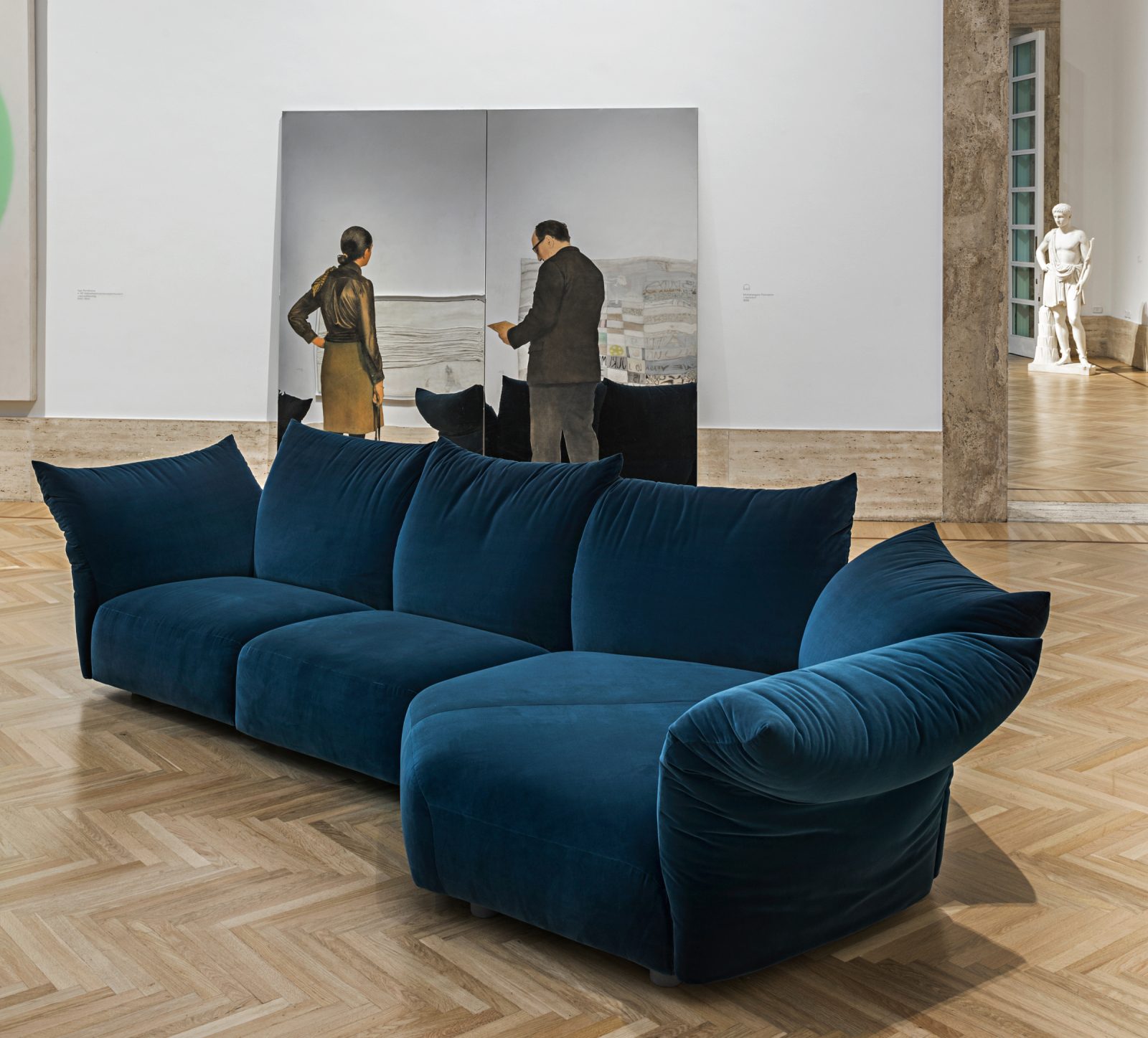 Blue Standard sofa by Edra feautered in an art gallery